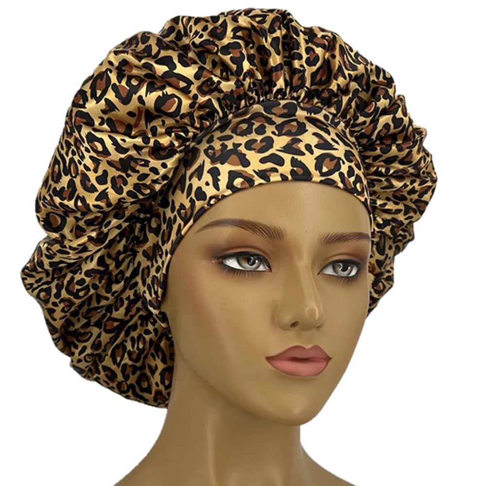 A woman wearing a stylish leopard print head wrap, showcasing a bold and fashionable accessory.